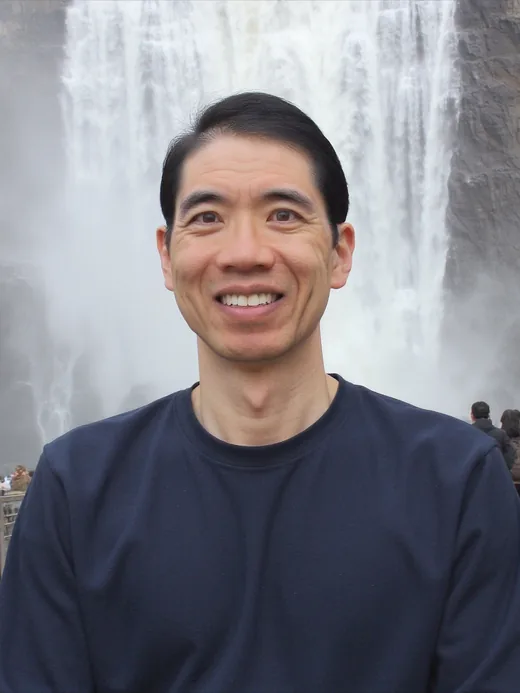 Customer photo in front of a waterfall